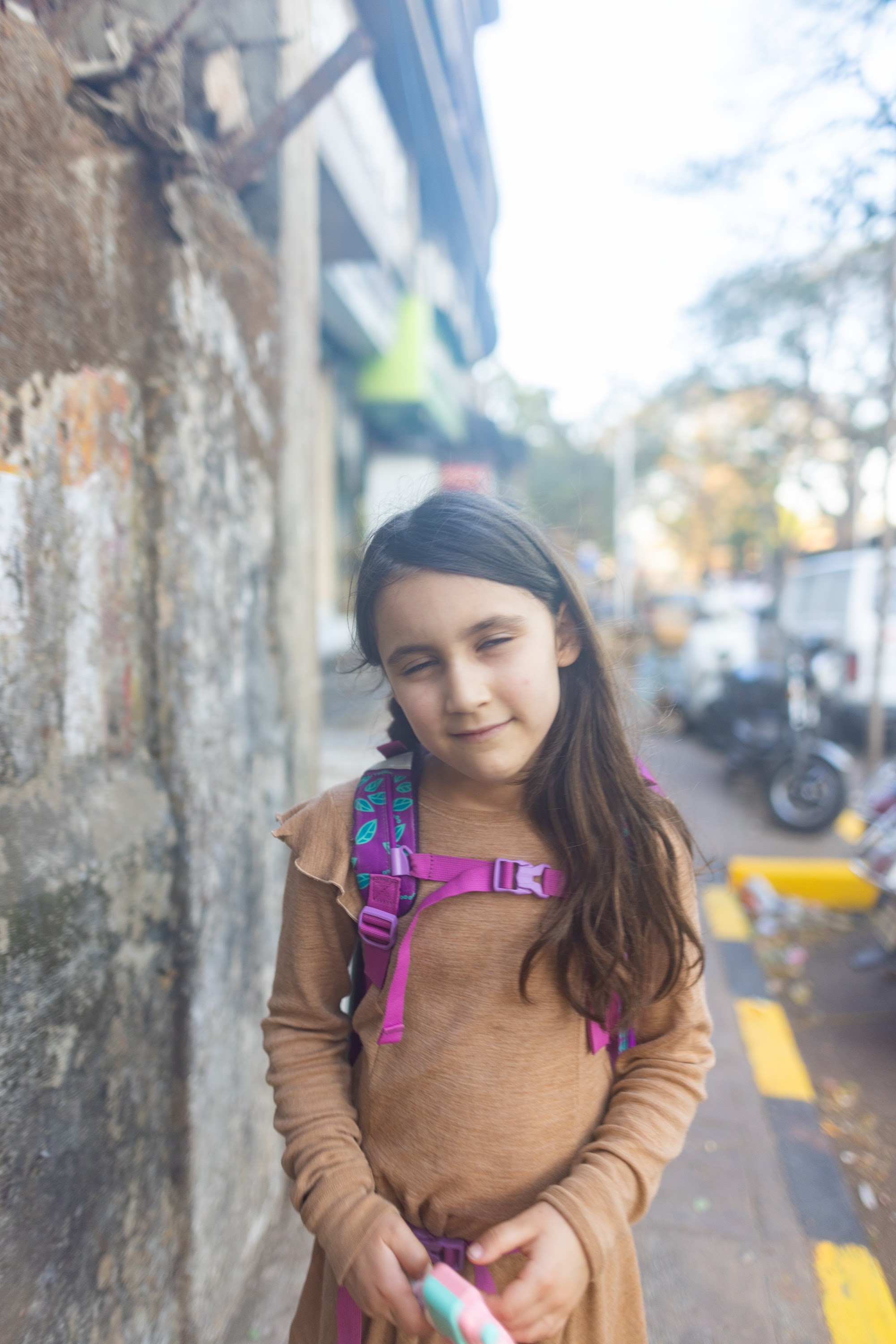 Girl with Backpack on Street