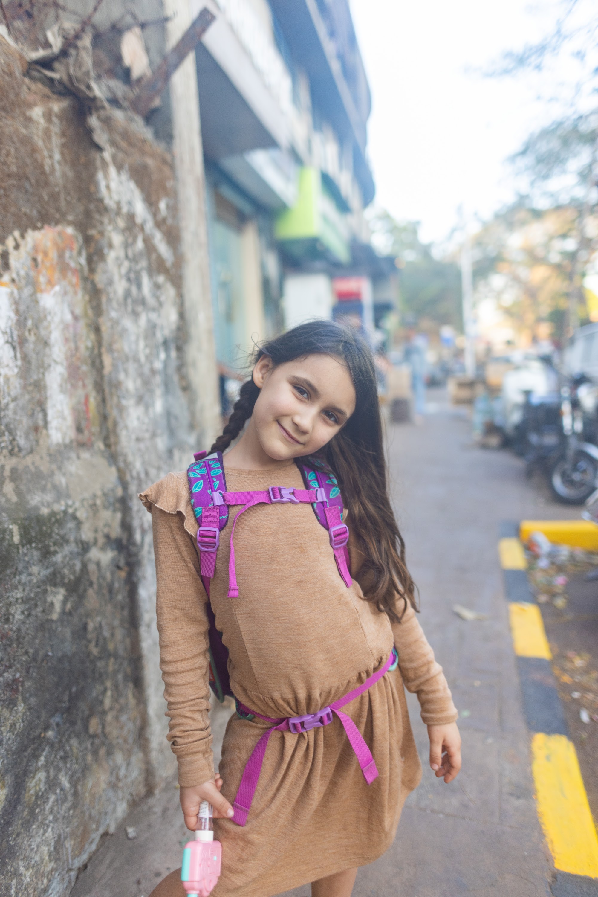 Girl with Pink Backpack on Street