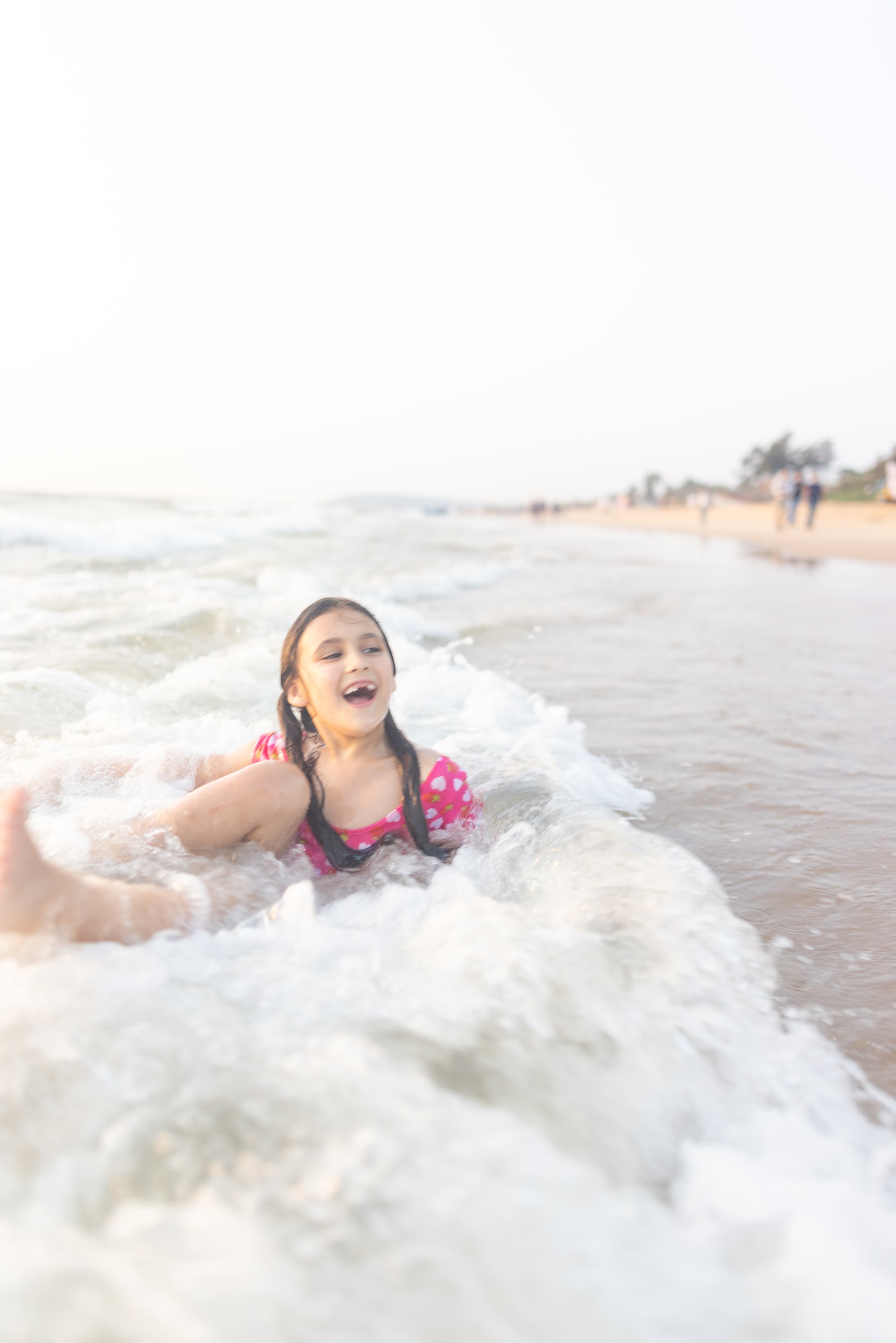 Girl Laughing in Ocean Wave Surf