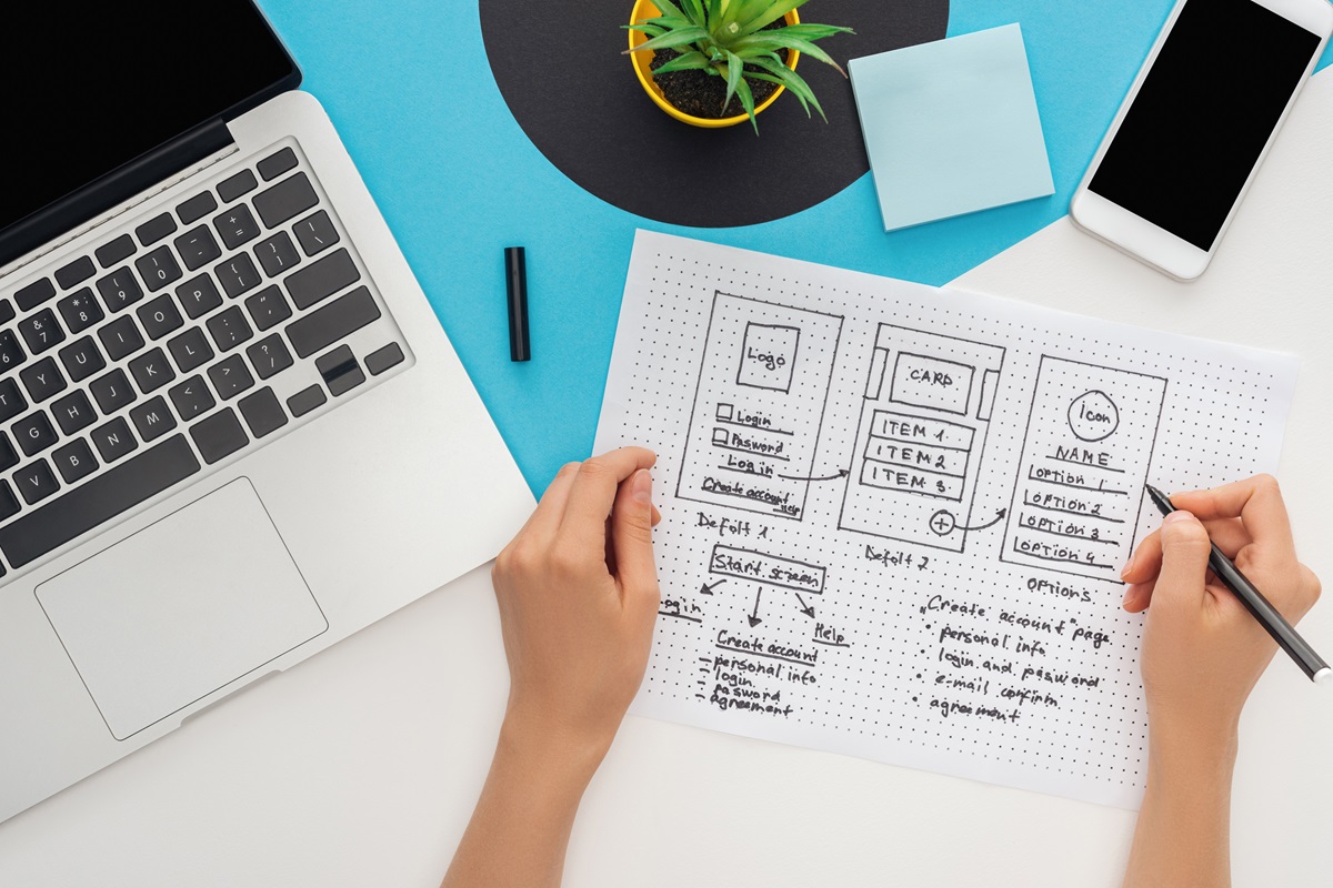 cropped-view-of-woman-holding-website-design-templ-2023-11-27-05-05-41-utc.jpg