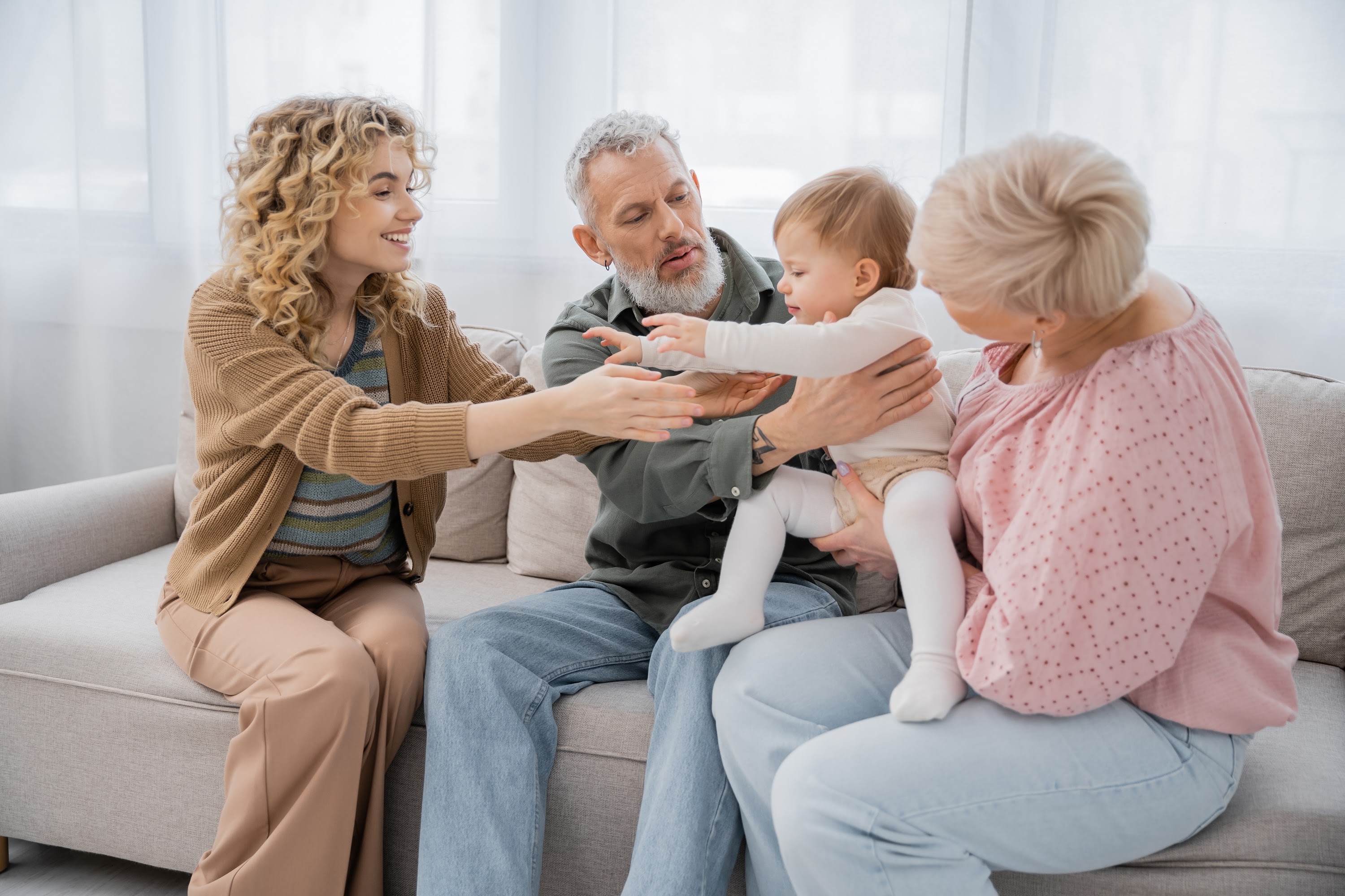 cheerful-blonde-woman-outstretching-hands-to-littl-2023-11-27-04-58-04-utc.jpg