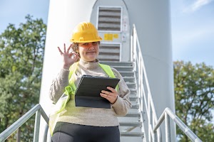 female-engineer-standing-on-the-staircase-and-show-2023-11-27-04-56-39-utc.jpg