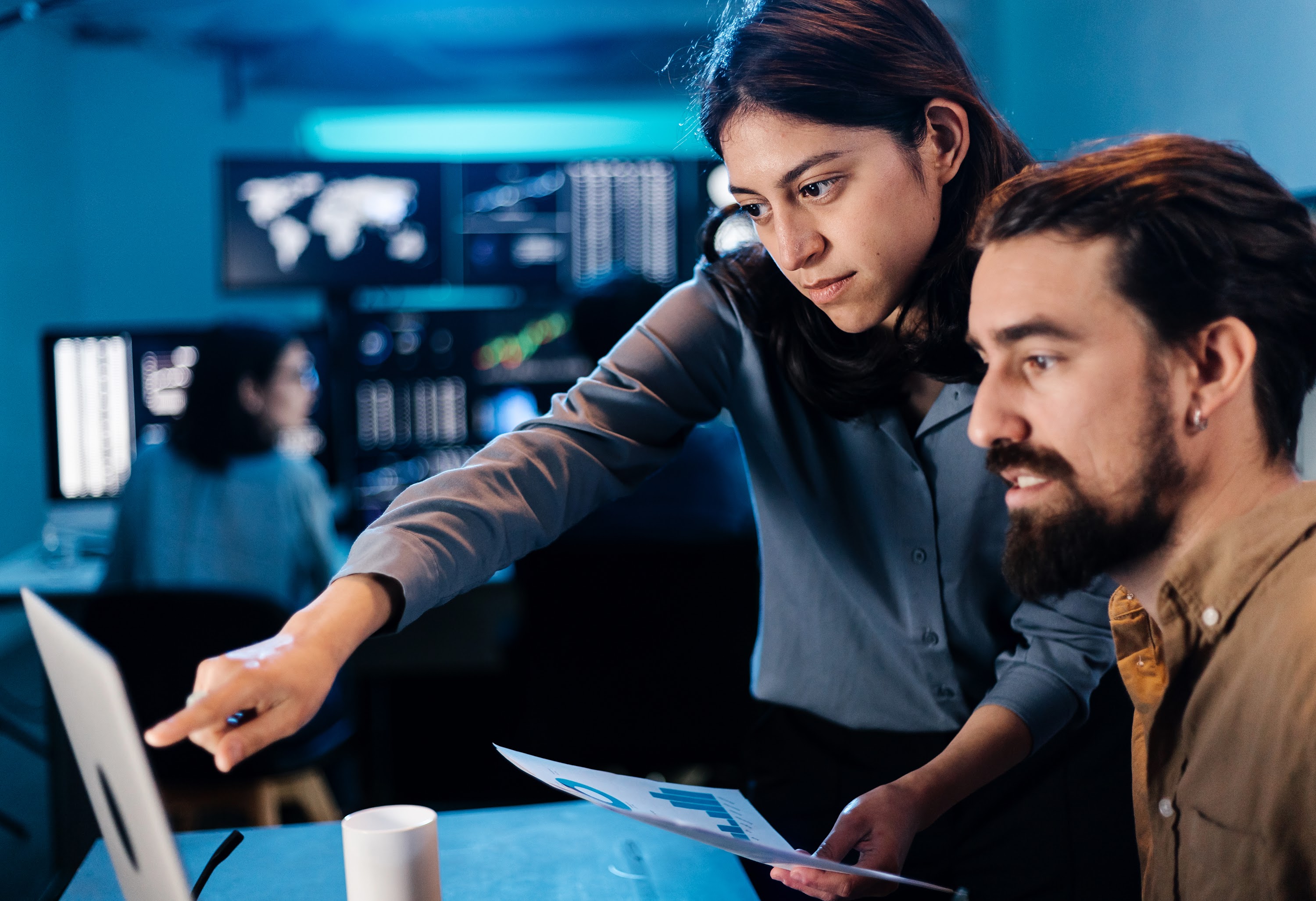 stock-trader-team-looking-and-analyzing-stock-data-2024-05-03-23-42-57-utc (1).jpg