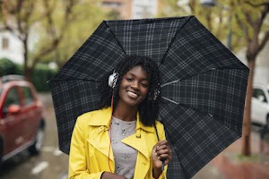 young-black-girl-with-umbrella-2023-11-27-05-02-30-utc.jpg