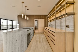 a-large-kitchen-with-marble-counter-tops-and-woode-2023-11-27-05-05-21-utc.jpg