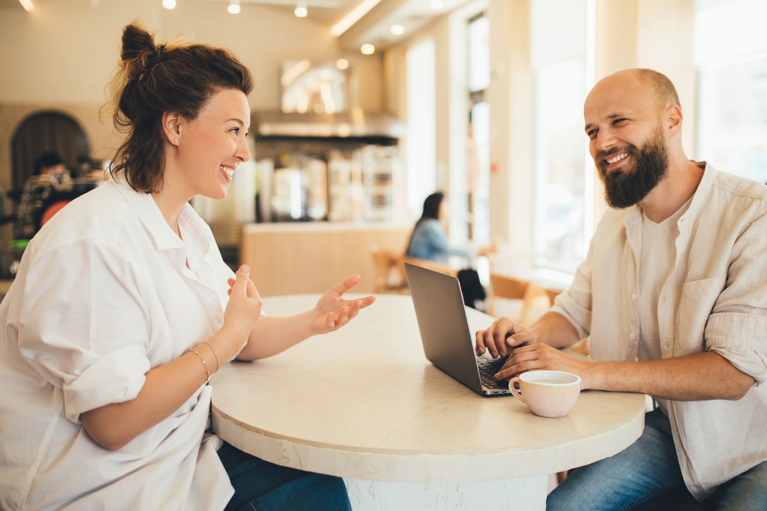 millennial-man-and-woman-discussing-business-proje-2023-11-27-05-32-04-utc.jpg