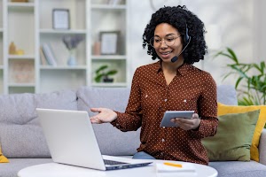 a-young-african-american-female-teacher-sits-at-ho-2024-01-31-19-05-18-utc.jpg