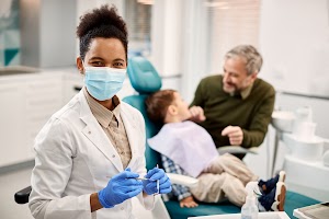 happy-black-pediatric-dentist-at-work-looking-at-c-2023-11-27-05-31-11-utc.jpg