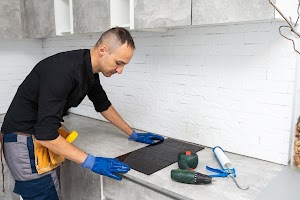man-electrical-repairs-kitchen-surface-apartment-2024-08-20-23-36-39-utc.jpg