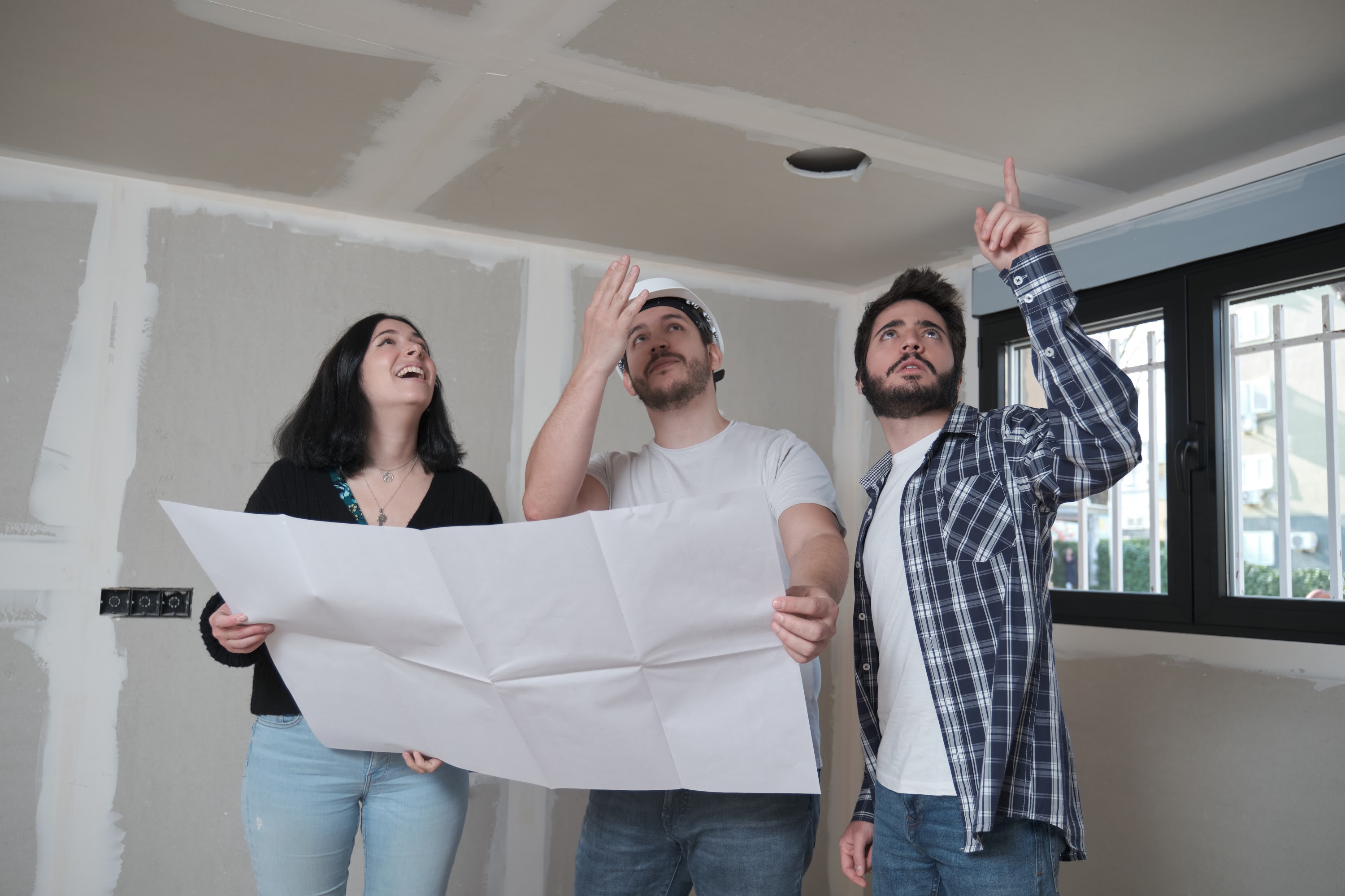 architect-shows-apartment-ceiling-blueprints-to-in-2023-11-27-04-57-40-utc.jpg
