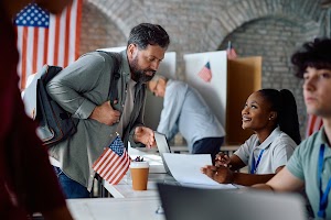 happy-black-volunteer-talking-to-a-voter-during-us-2024-02-29-05-12-43-utc (1).jpg