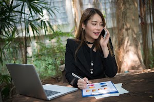 happy-business-woman-signing-on-document-in-a-desk-2023-11-27-05-14-22-utc.jpg