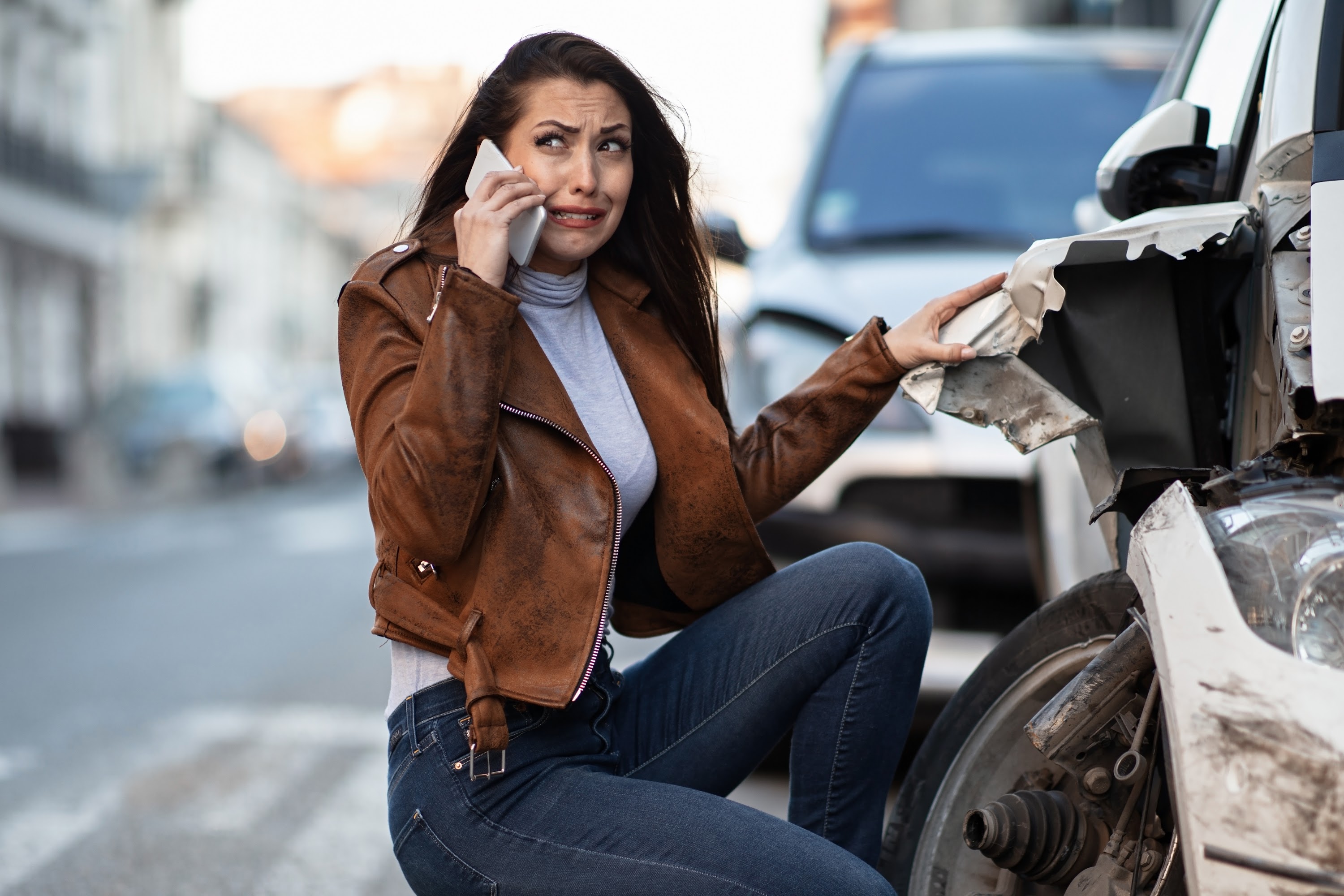 frustrated-woman-calling-for-help-after-a-car-acci-2023-11-27-05-32-39-utc.jpg