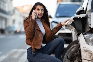 frustrated-woman-calling-for-help-after-a-car-acci-2023-11-27-05-32-39-utc.jpg
