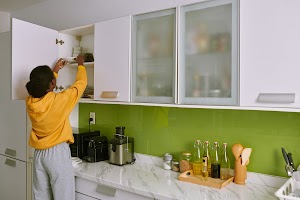 woman-taking-plate-out-of-cabinet-2023-11-27-05-04-55-utc.jpg
