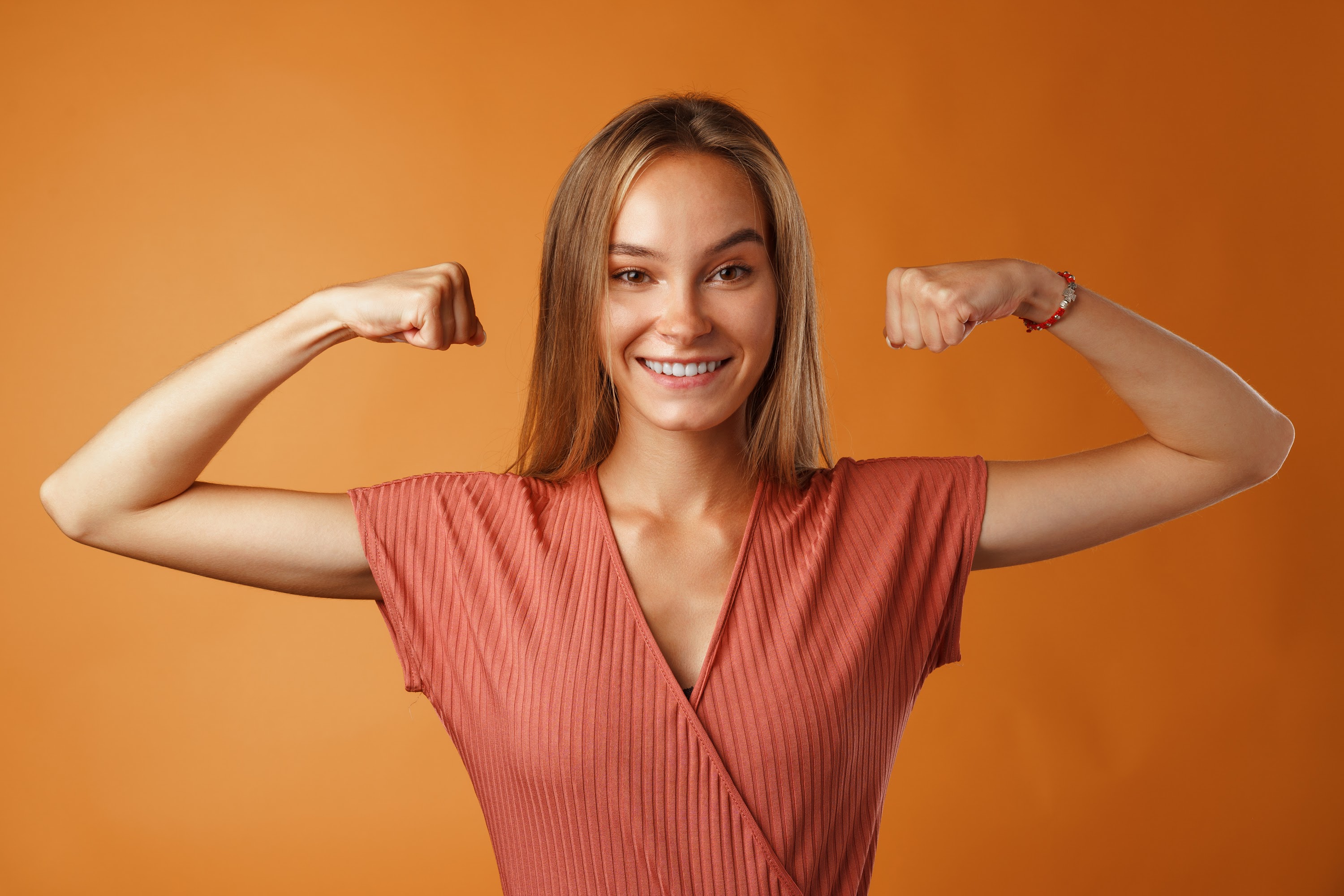 funny-young-blonde-woman-showing-how-strong-her-ha-2023-11-27-05-03-57-utc.jpg