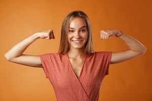 funny-young-blonde-woman-showing-how-strong-her-ha-2023-11-27-05-03-57-utc.jpg
