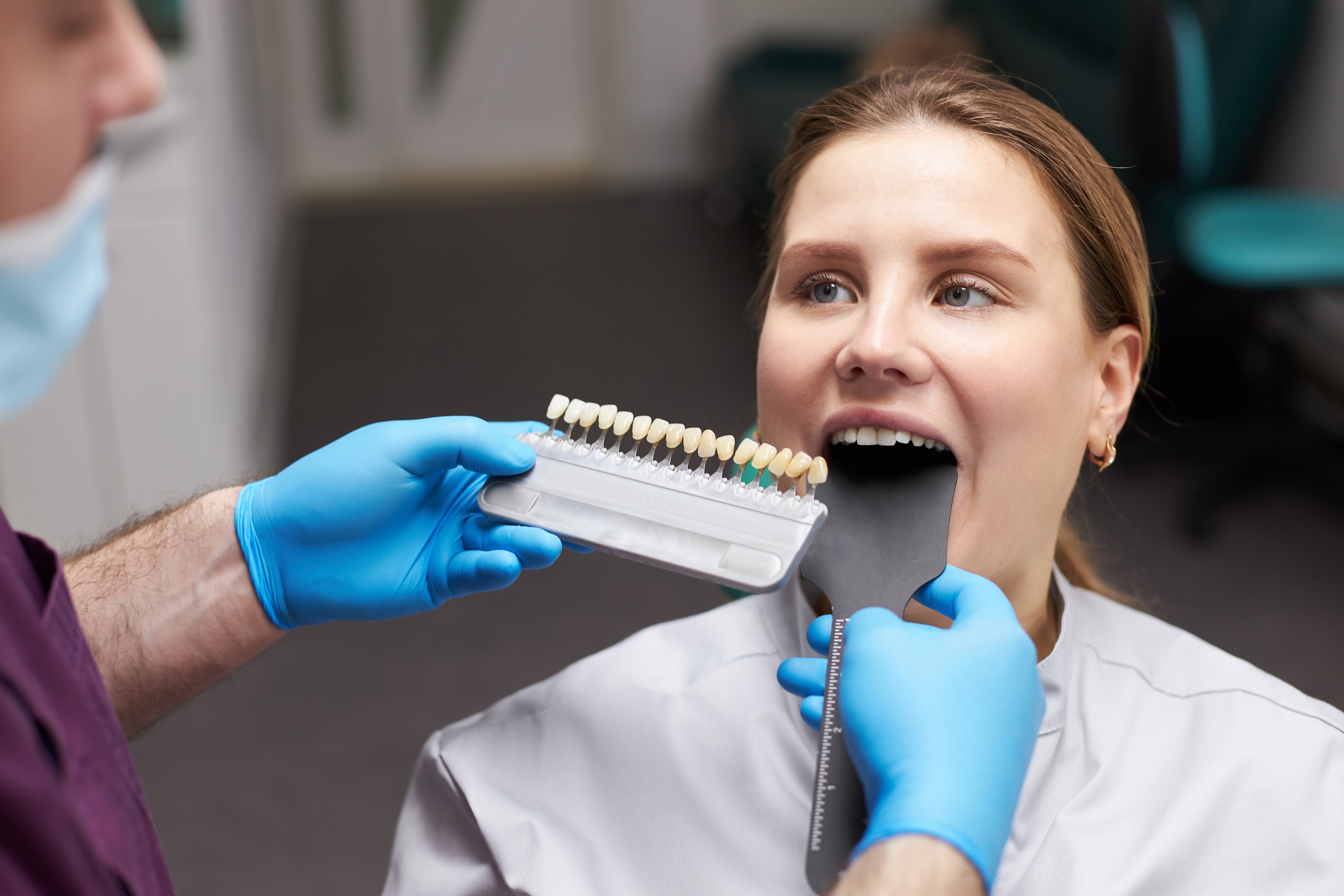 dentist-orthodontist-using-a-tooth-color-chart-ch-2023-11-27-04-51-37-utc.jpg