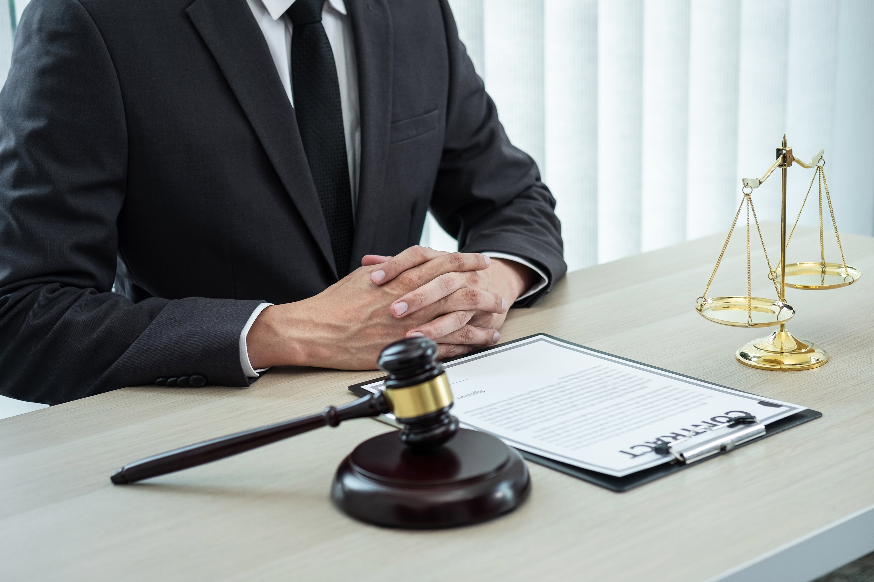 male-lawyer-working-with-legal-case-document-contr-2024-09-16-01-54-39-utc.jpg