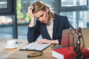portrait-of-tired-lawyer-doing-paperwork-at-workpl-2023-11-27-05-29-11-utc.jpg