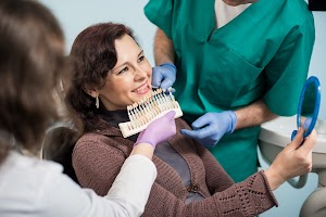 dentist-with-assistant-checking-and-selecting-colo-2023-11-27-05-02-33-utc.jpg