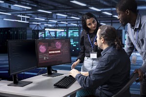 multiethnic-staff-members-in-data-center-trying-to-2024-10-14-20-04-41-utc.jpg