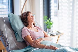 a-female-patient-with-iv-drip-lying-in-bed-in-hosp-2024-10-20-23-32-10-utc.jpg