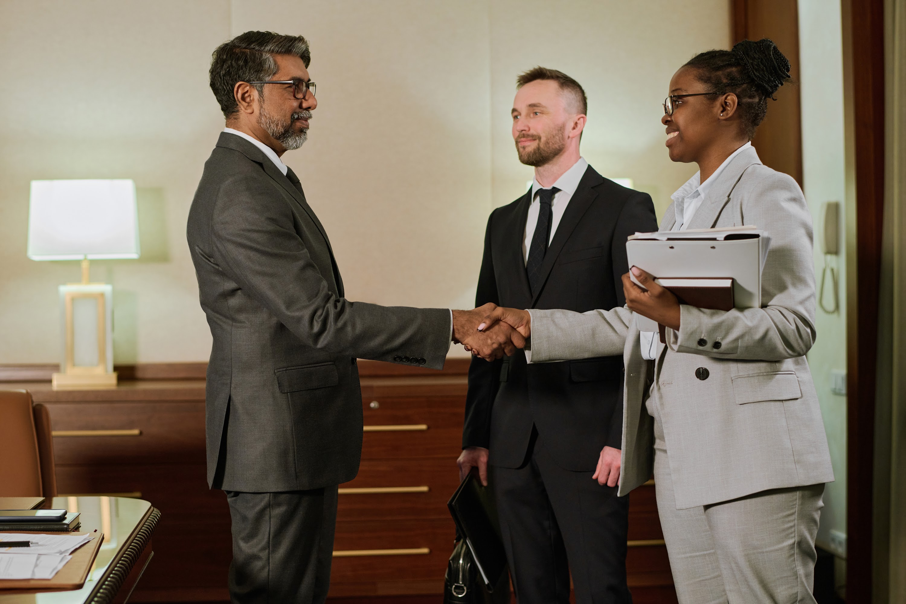 businesswoman-shaking-hand-of-partner-2024-07-16-15-46-41-utc.jpg