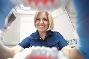 pov-view-happy-smiling-doctor-in-dental-office-tak-2023-11-27-04-49-10-utc.jpg