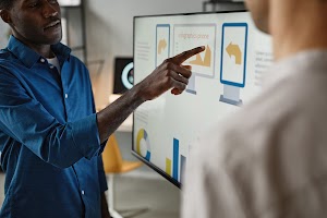 man-using-digital-whiteboard-in-office-2023-11-27-04-50-45-utc.jpg