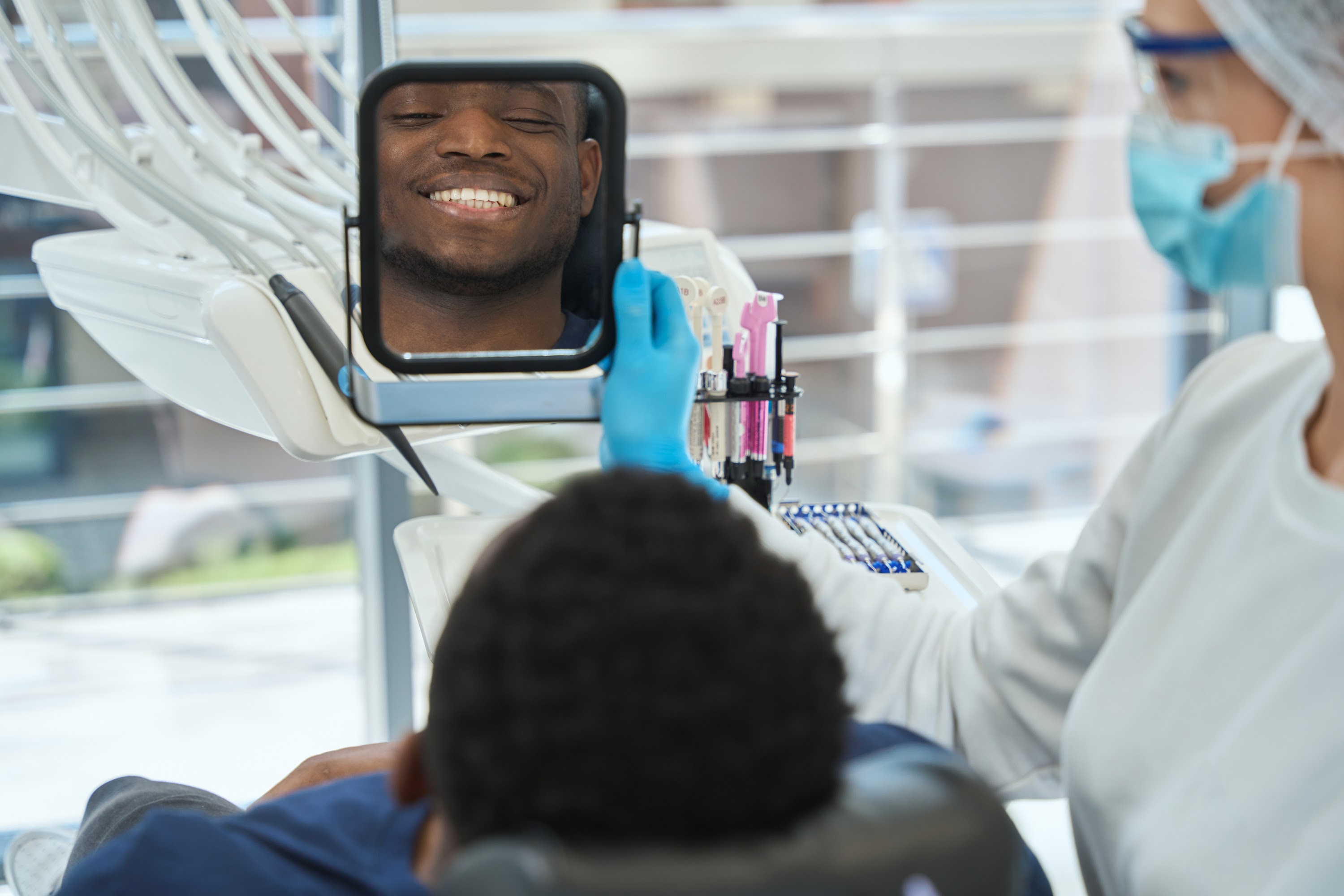 patient-looking-at-result-after-dental-treatment-i-2024-10-19-18-48-23-utc.jpg