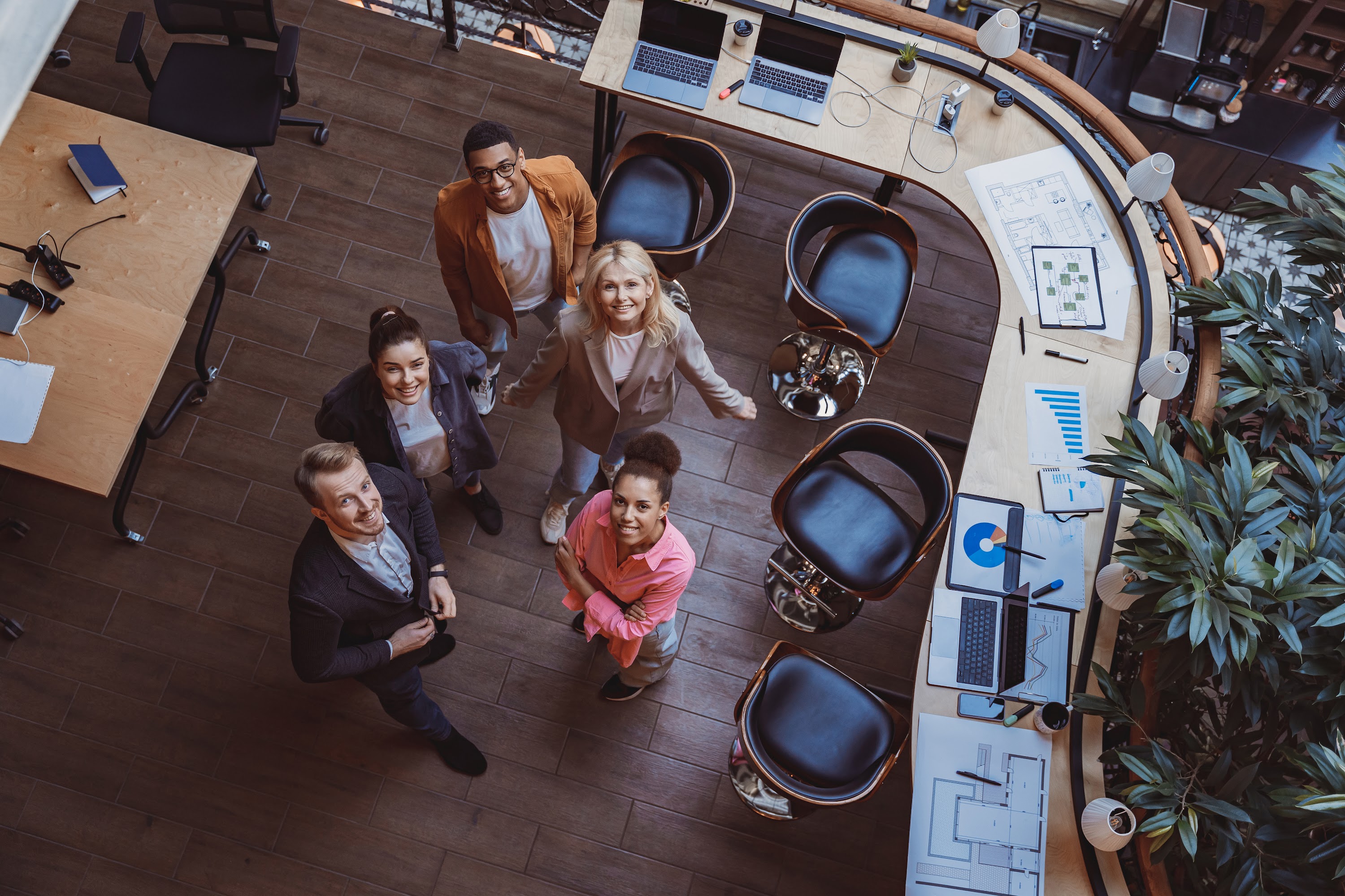 group-of-coworkers-standing-at-office-and-looking-2023-11-27-04-53-00-utc.jpg