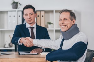 businessman-shaking-hands-with-worker-in-neck-brac-2024-11-17-10-35-40-utc.jpg