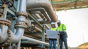 engineer-holding-blueprint-drawing-to-checking-ga-2024-11-29-23-28-20-utc.jpg