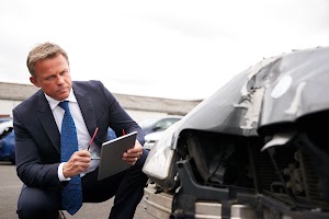 male-insurance-loss-adjuster-with-digital-tablet-i-2024-10-19-16-05-44-utc.jpg