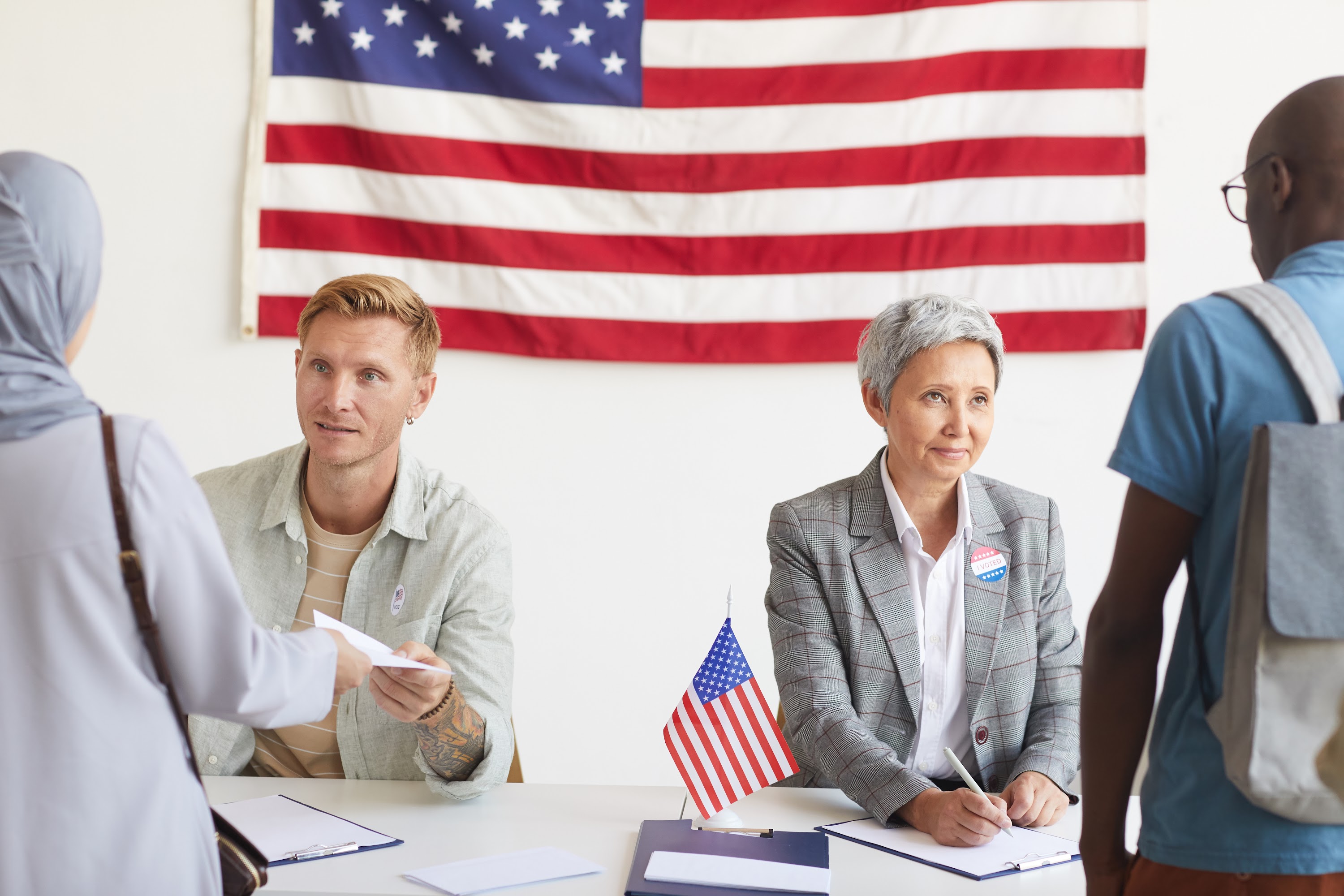two-workers-at-voting-station-2023-11-27-05-10-52-utc.jpg
