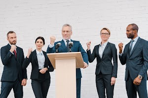 happy-speaker-in-glasses-and-multicultural-busines-2024-11-07-16-33-41-utc.jpg