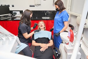 a-woman-is-getting-her-teeth-cleaned-by-a-dentist-2024-11-14-23-52-43-utc.jpg