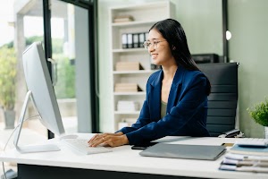 asian-woman-sitting-at-a-desk-using-a-laptop-compu-2024-11-01-21-26-28-utc.jpg