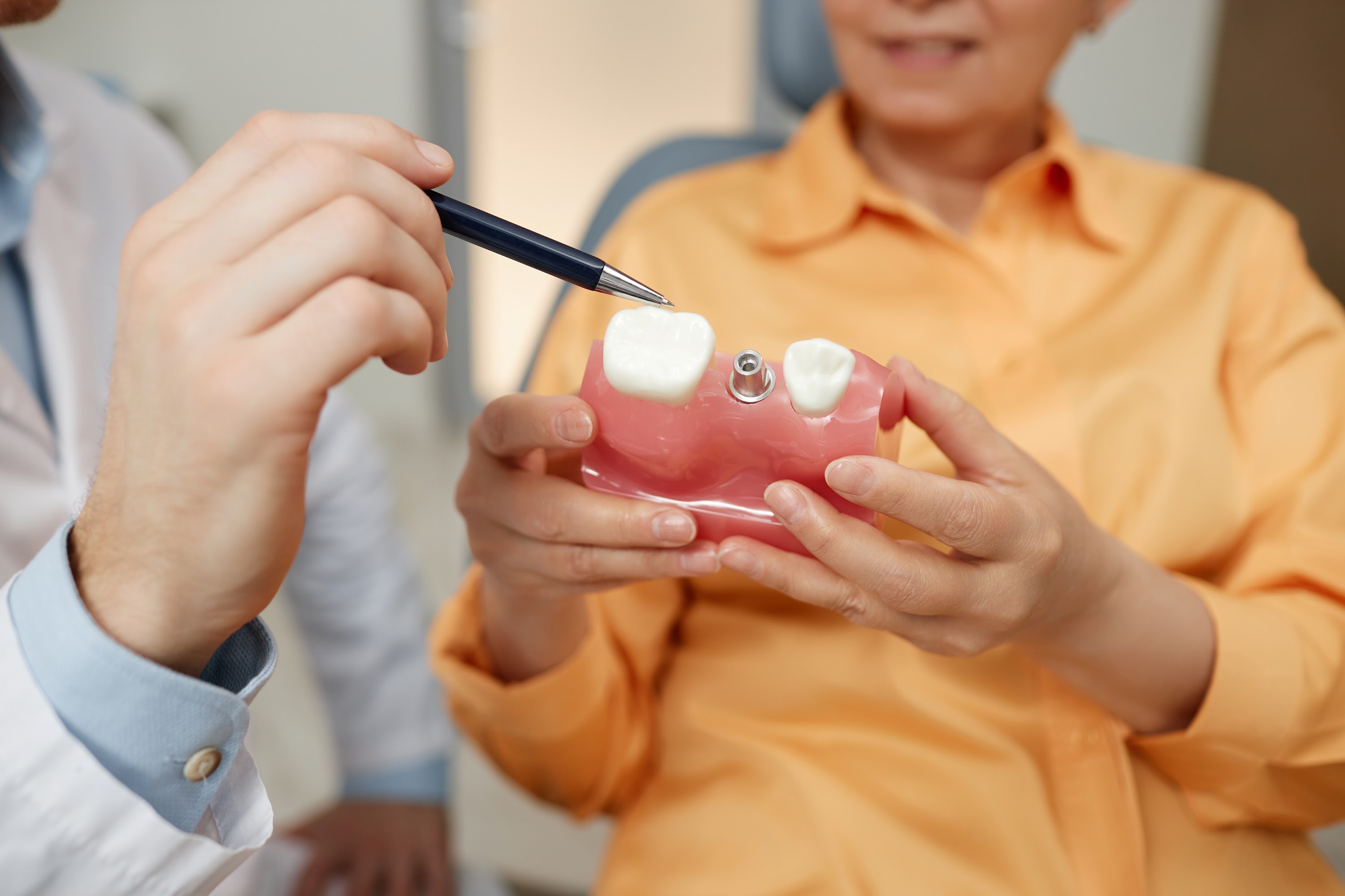 closeup-of-unrecognizable-dentist-pointing-at-toot-2023-11-27-05-09-21-utc.jpg