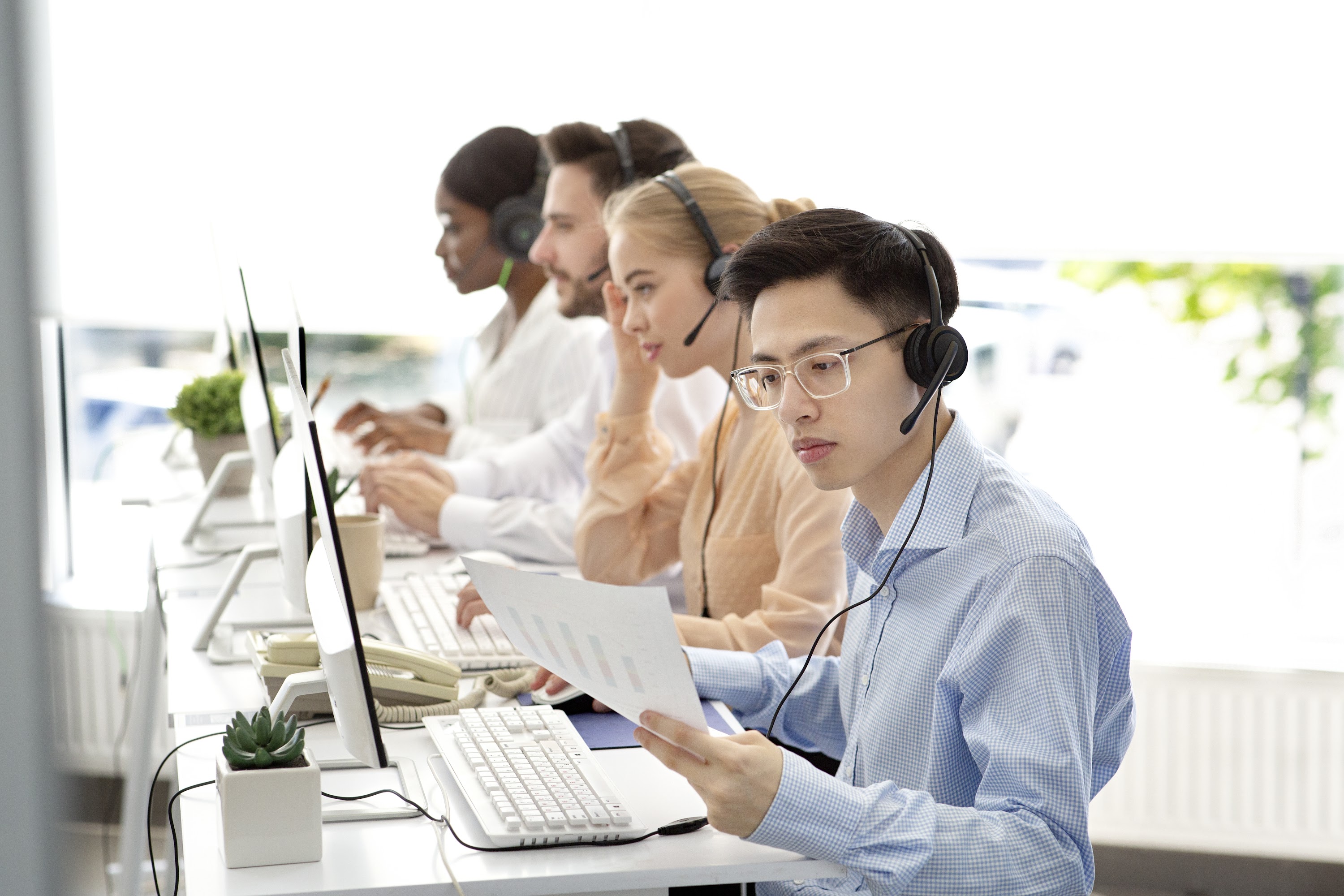asian-hotline-operator-working-with-documents-pro-2023-11-27-05-32-57-utc.jpg
