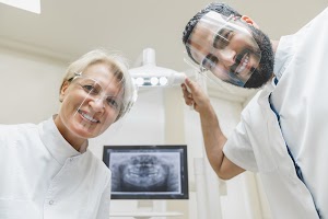 dentists-looking-checking-up-patient-s-mouth-cavit-2025-01-09-17-54-56-utc.JPG