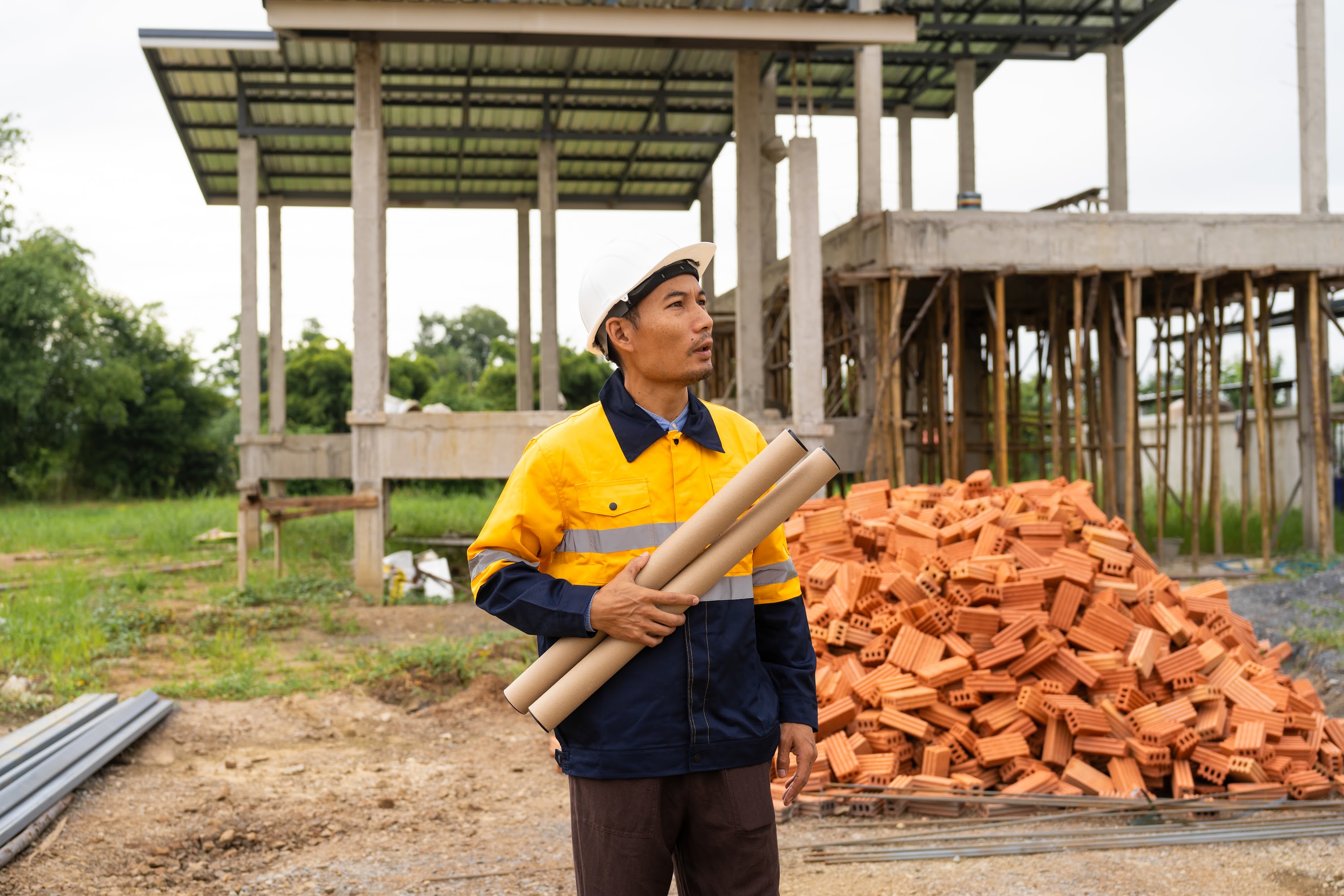 a-male-architect-wearing-a-hard-hat-safety-vest-ch-2024-08-20-21-36-31-utc.jpg