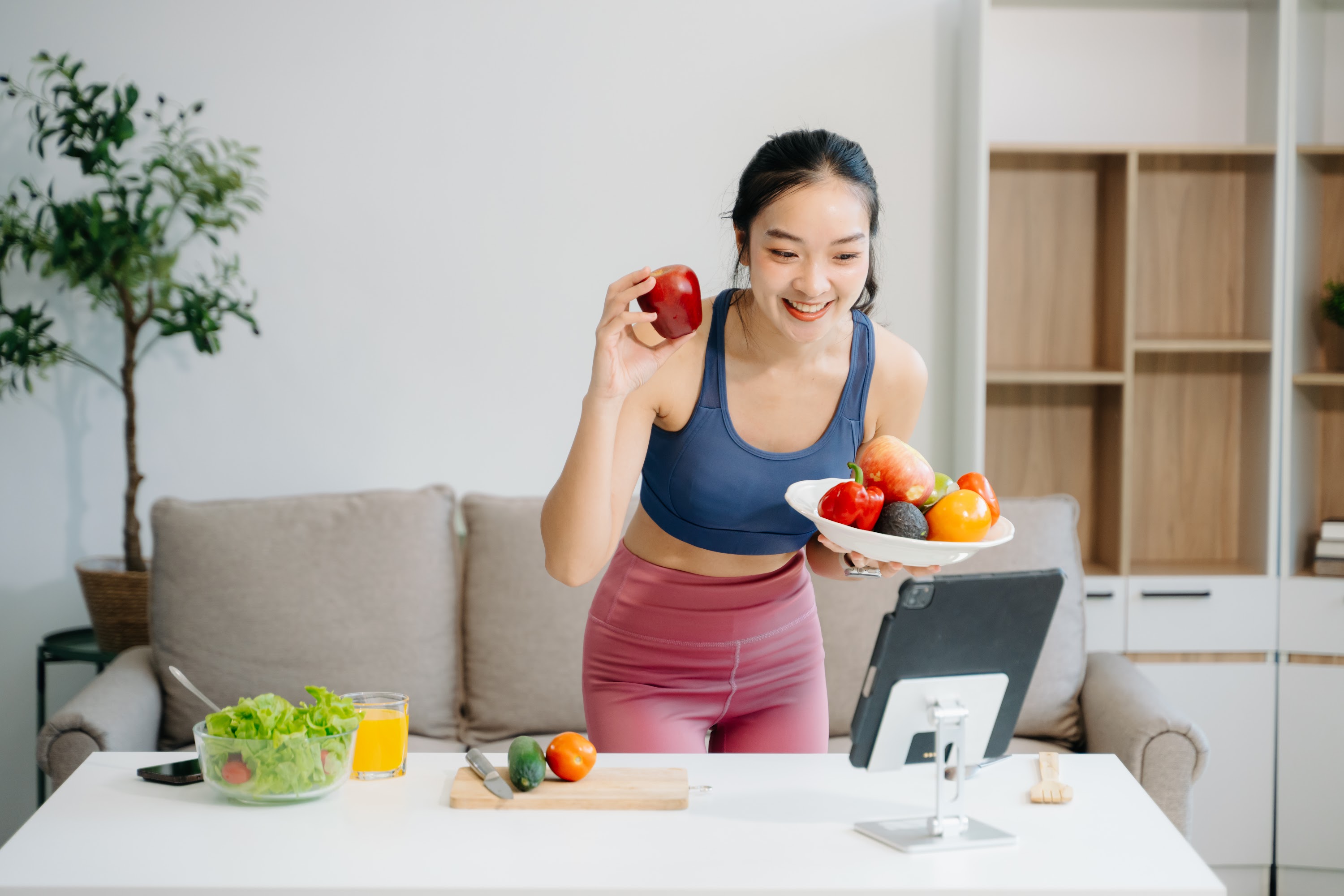 woman-enjoys-a-fresh-salad-with-fruits-and-juice-2025-02-10-11-41-15-utc.jpg