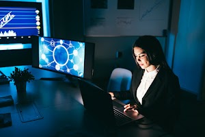 young-business-woman-working-at-night-inside-finte-2025-02-22-05-02-42-utc.jpg