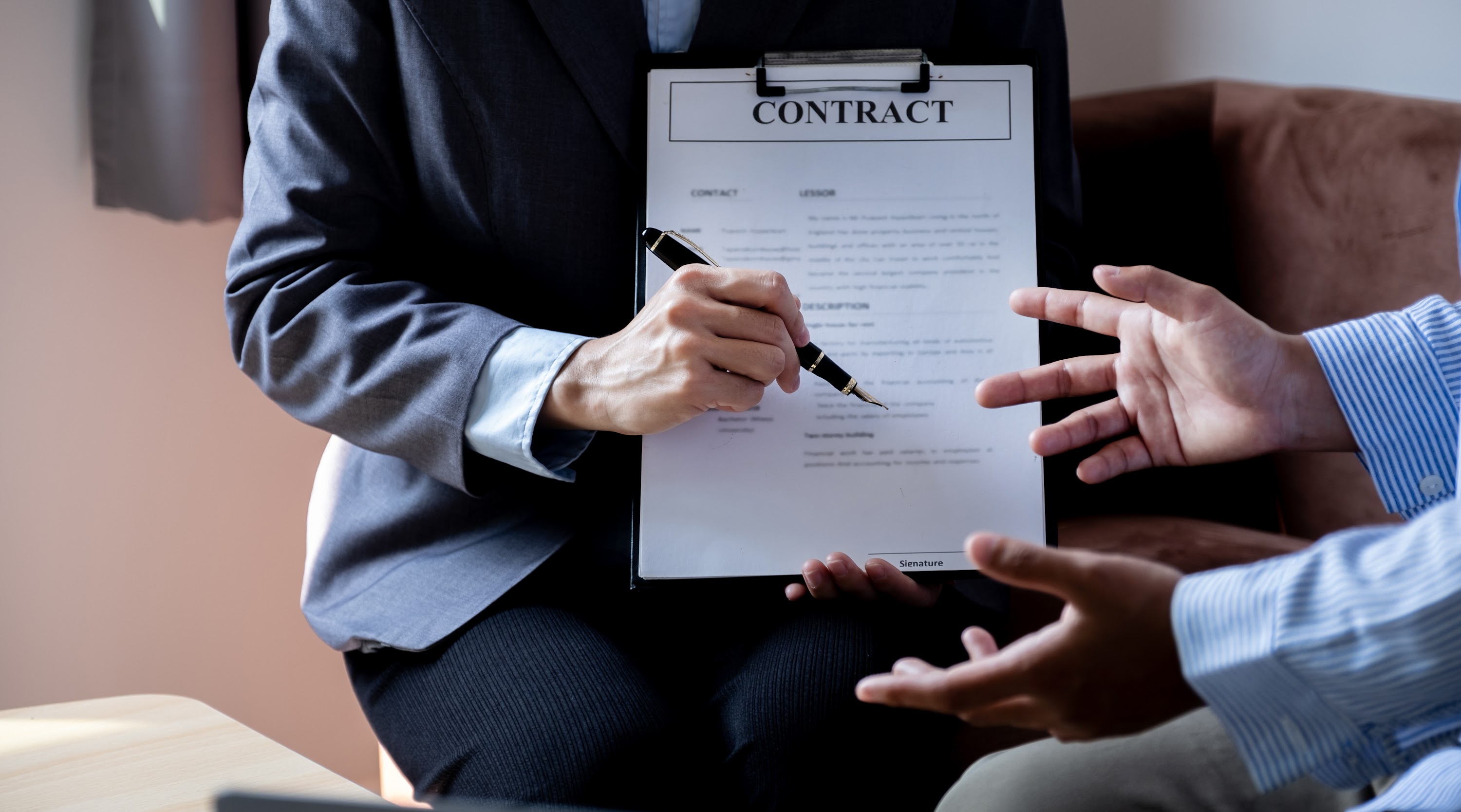 real-estate-agent-explains-the-business-contract-2025-02-12-01-24-08-utc.jpg
