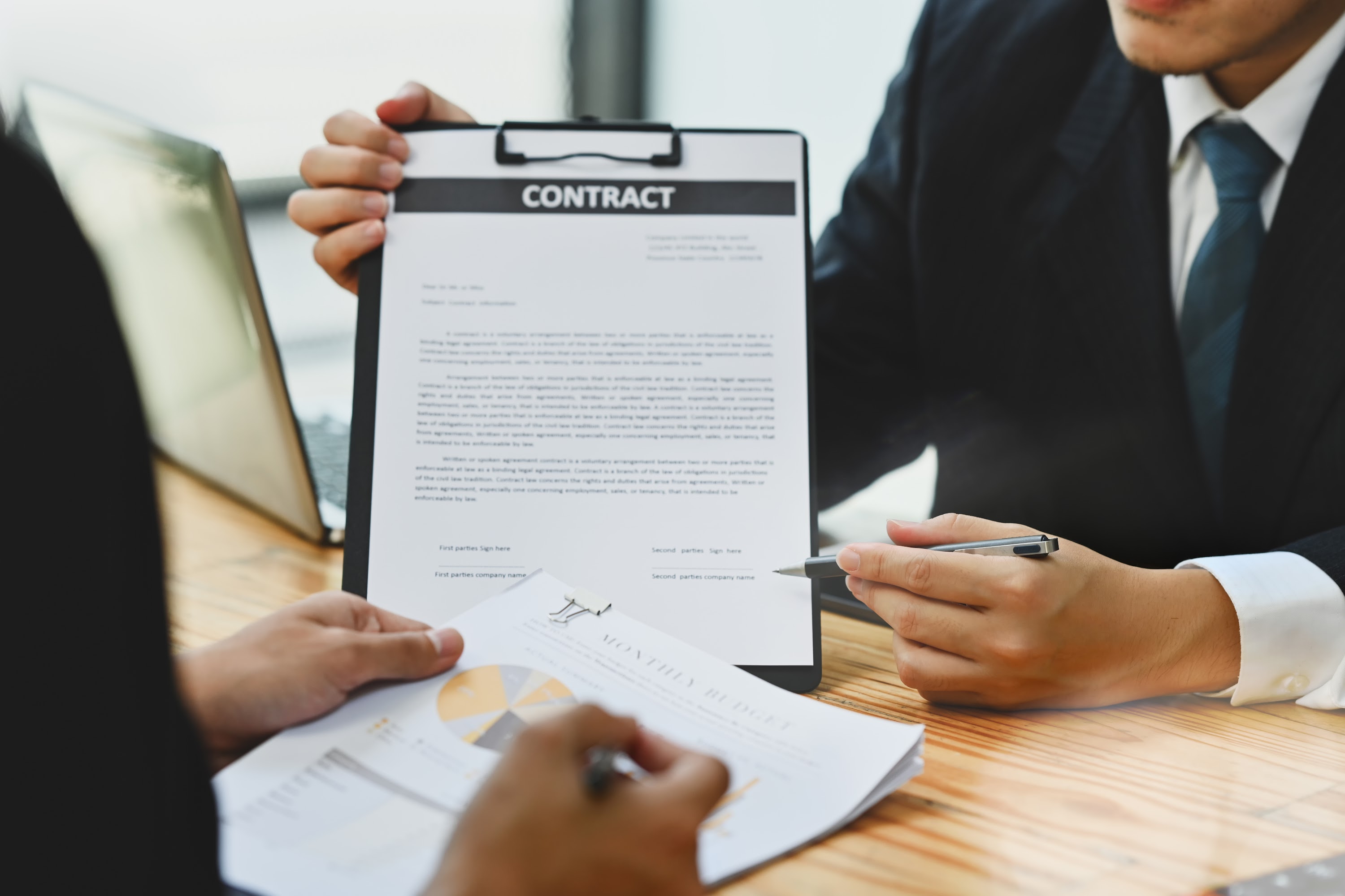 real-estate-agent-or-bank-worker-showing-contract-2024-11-28-11-23-22-utc.jpg