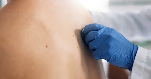 doctor-hand-and-stethoscope-on-back-of-patient-in-2024-11-05-11-03-22-utc.jpg