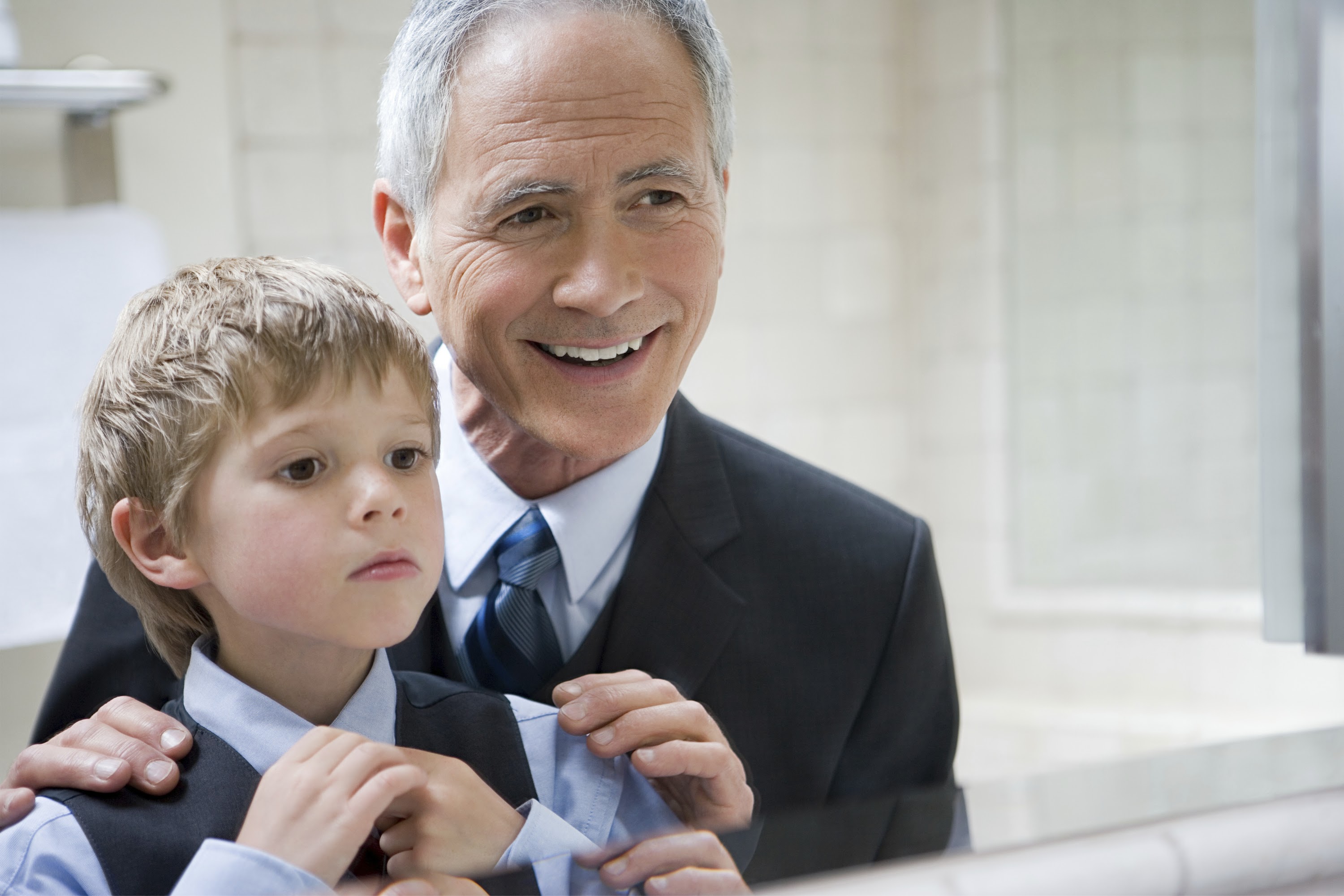 man-helping-grandson-to-tie-his-tie-2025-04-05-03-49-42-utc.jpg