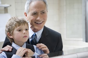man-helping-grandson-to-tie-his-tie-2025-04-05-03-49-42-utc.jpg
